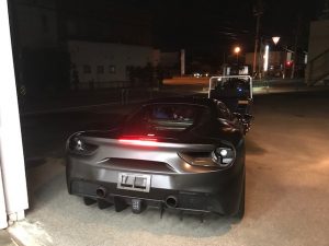 フェラーリ488GTBマットブラックフルラッピング施工完成ガレージ外後ろから